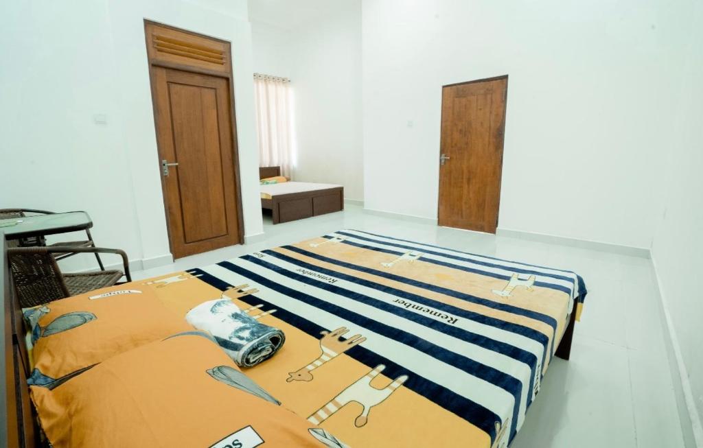 Postel nebo postele na pokoji v ubytování Sky Lounge