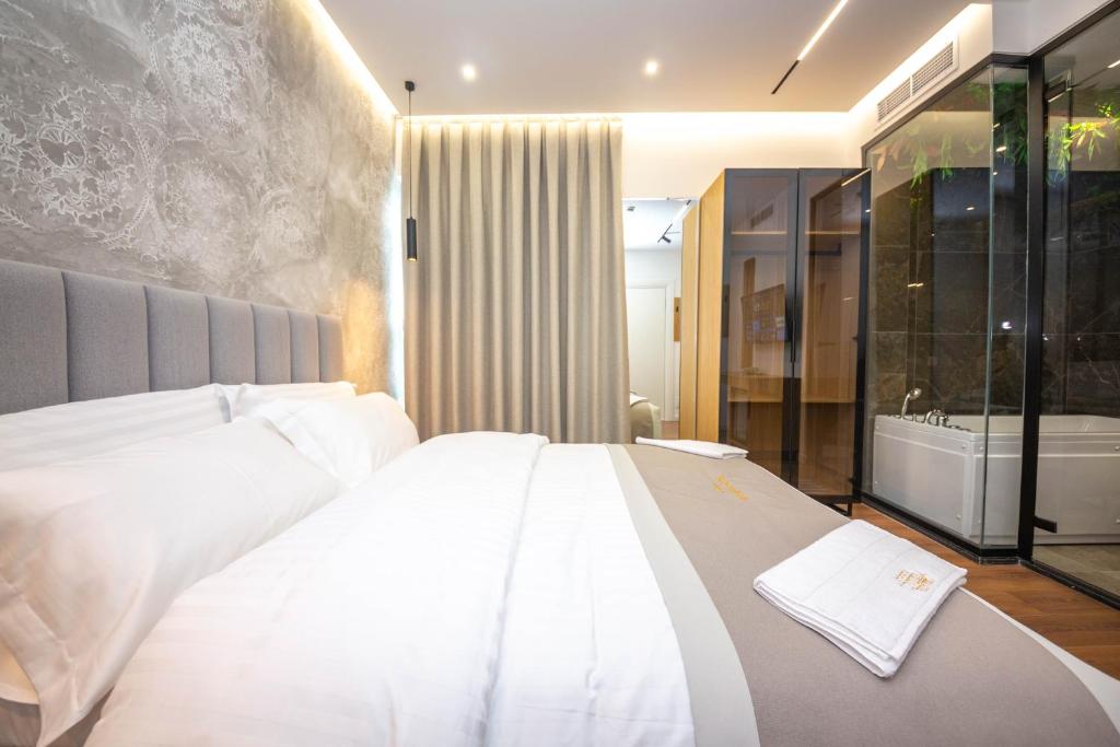 Postel nebo postele na pokoji v ubytování Hotel Riviera