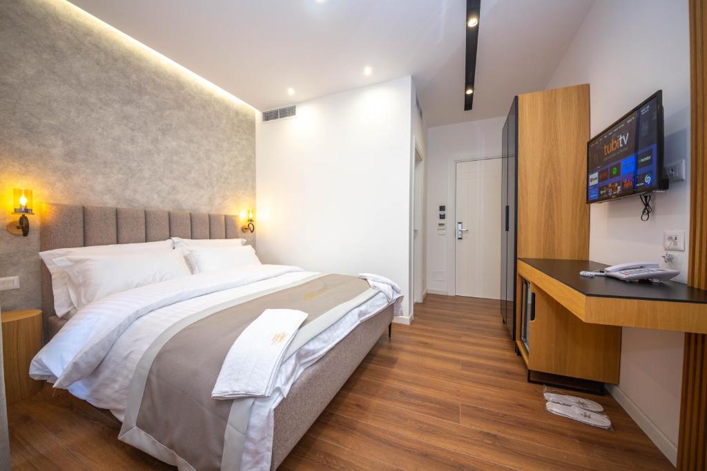 TV a/nebo společenská místnost v ubytování Hotel Riviera
