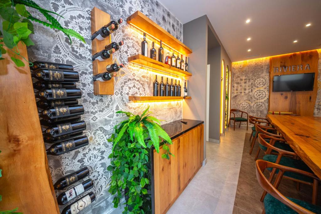 TV a/nebo společenská místnost v ubytování Hotel Riviera