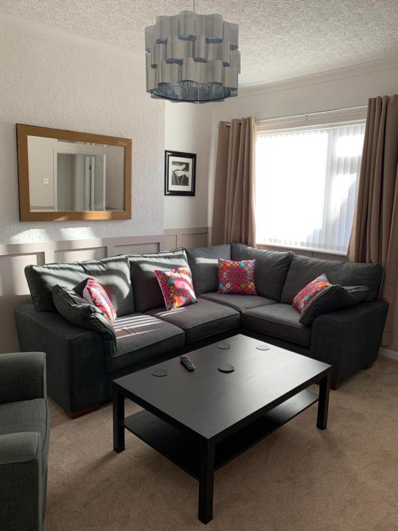 a living room with a couch and a coffee table at Coronation Place, Durham in Langley Park