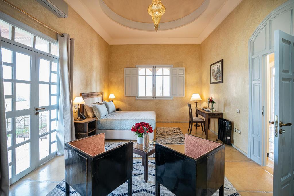Postel nebo postele na pokoji v ubytování Palais Alcazar
