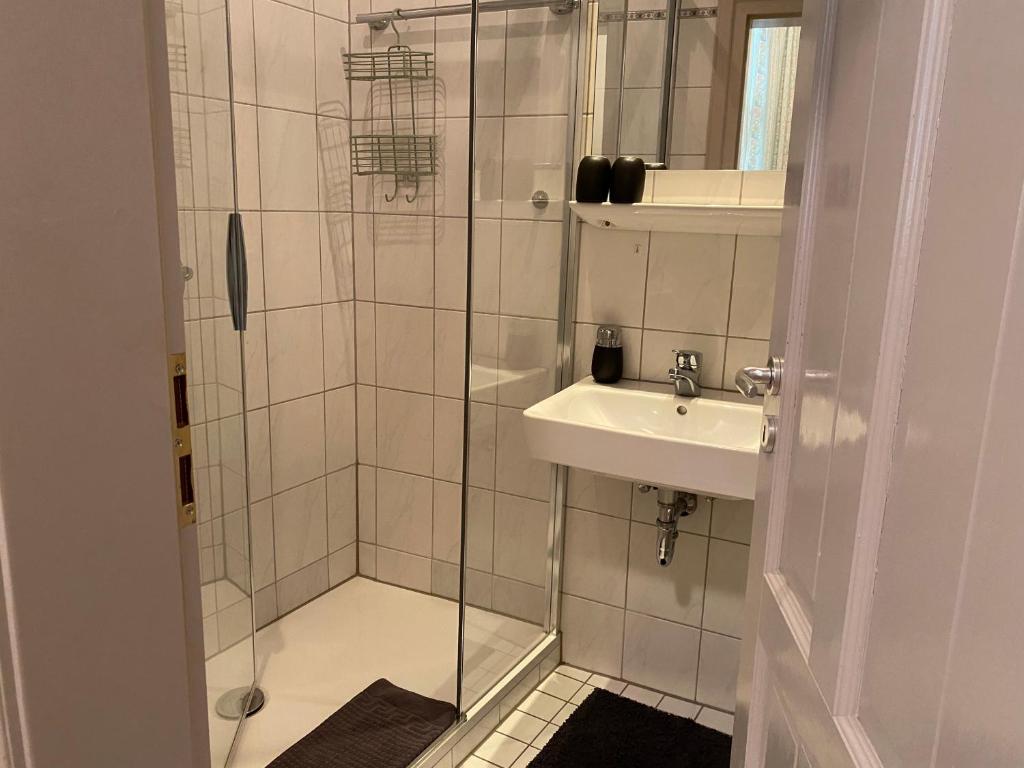 a bathroom with a shower and a sink at Hotel Weinstube am Markt in Gerolzhofen