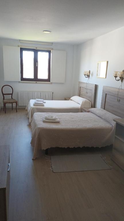 Posteľ alebo postele v izbe v ubytovaní Hostal padornelo