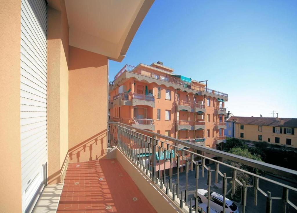 a balcony with a view of a building at Vittorio Veneto 9 in Borghetto Santo Spirito