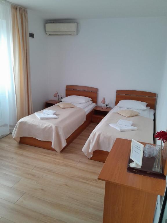 Postel nebo postele na pokoji v ubytování Old Pensiunea Otopeni