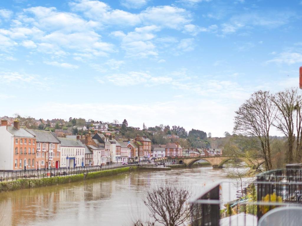 a city with a river and buildings and a bridge at 3 Bed in Bewdley 93837 in Bewdley