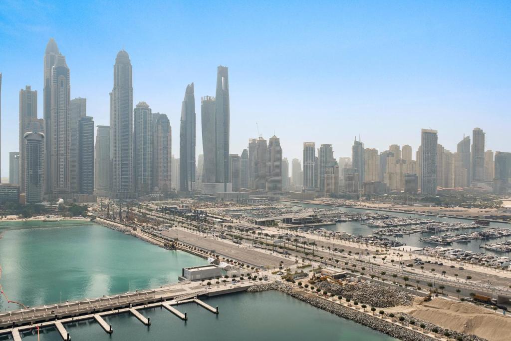 an aerial view of a large city with a harbor at Silkhaus Marina View with Tower's Private Beach in Dubai