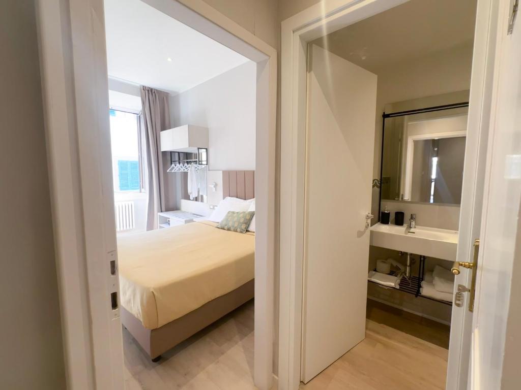 Postel nebo postele na pokoji v ubytování Hotel Giappone