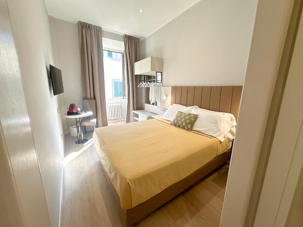 Postel nebo postele na pokoji v ubytování Hotel Giappone