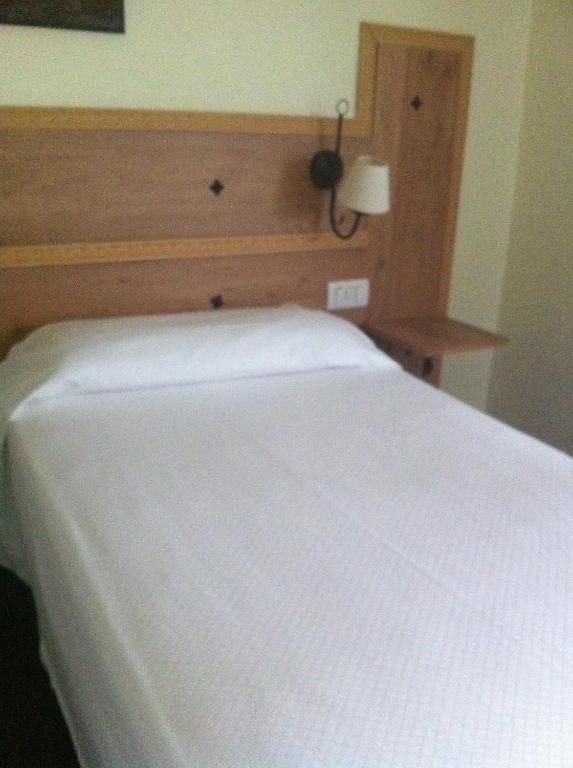 Postel nebo postele na pokoji v ubytování Hotel Boliña
