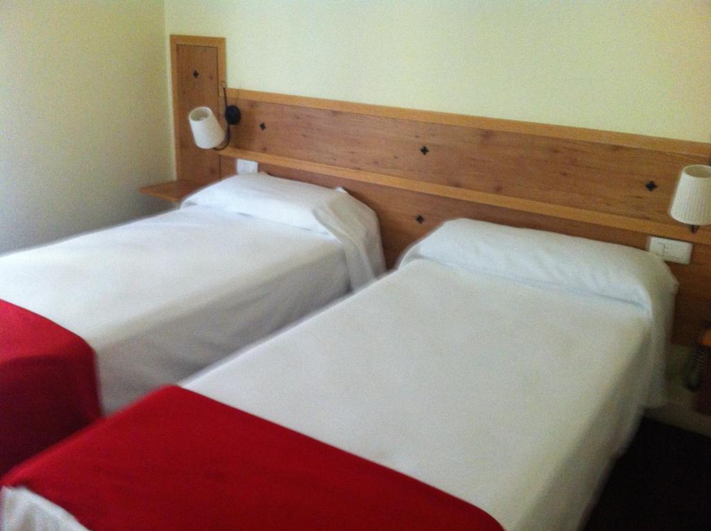 Postel nebo postele na pokoji v ubytování Hotel Boliña