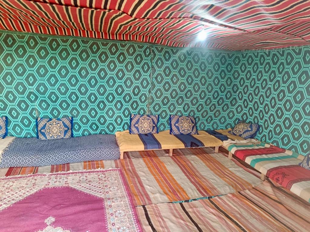 Letto o letti in una camera di Mhamid Sahara Camp - Mhamid El Ghizlane