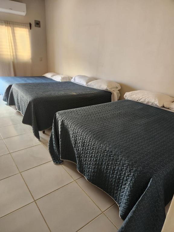 Postel nebo postele na pokoji v ubytování Aparta Hotel Palmerola