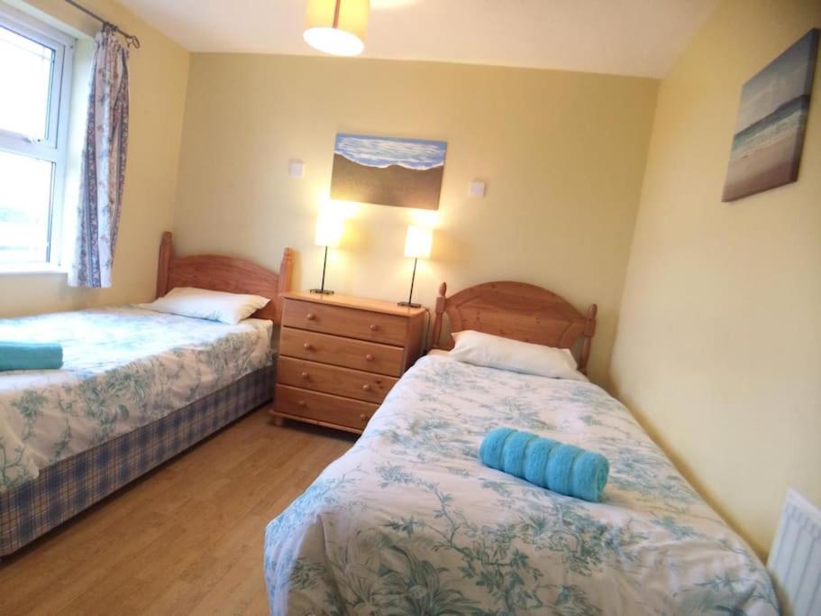 Postel nebo postele na pokoji v ubytování 4 Rossnowlagh Creek Chalets