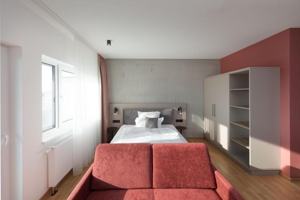 Postel nebo postele na pokoji v ubytování Brera Serviced Apartments Singen