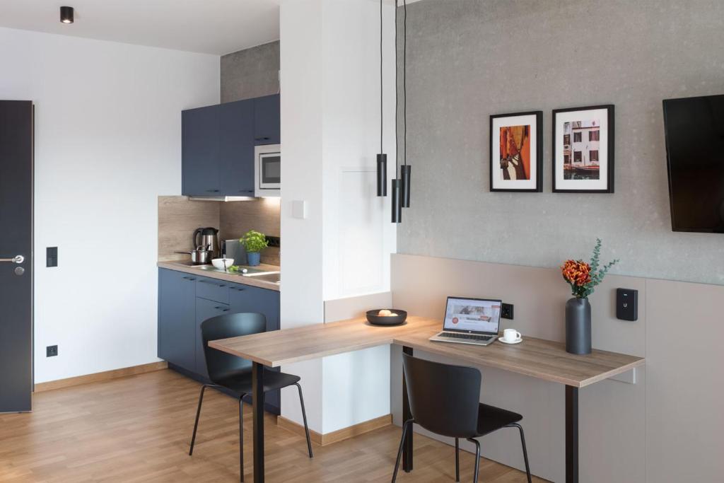 Kuchyň nebo kuchyňský kout v ubytování Brera Serviced Apartments Singen
