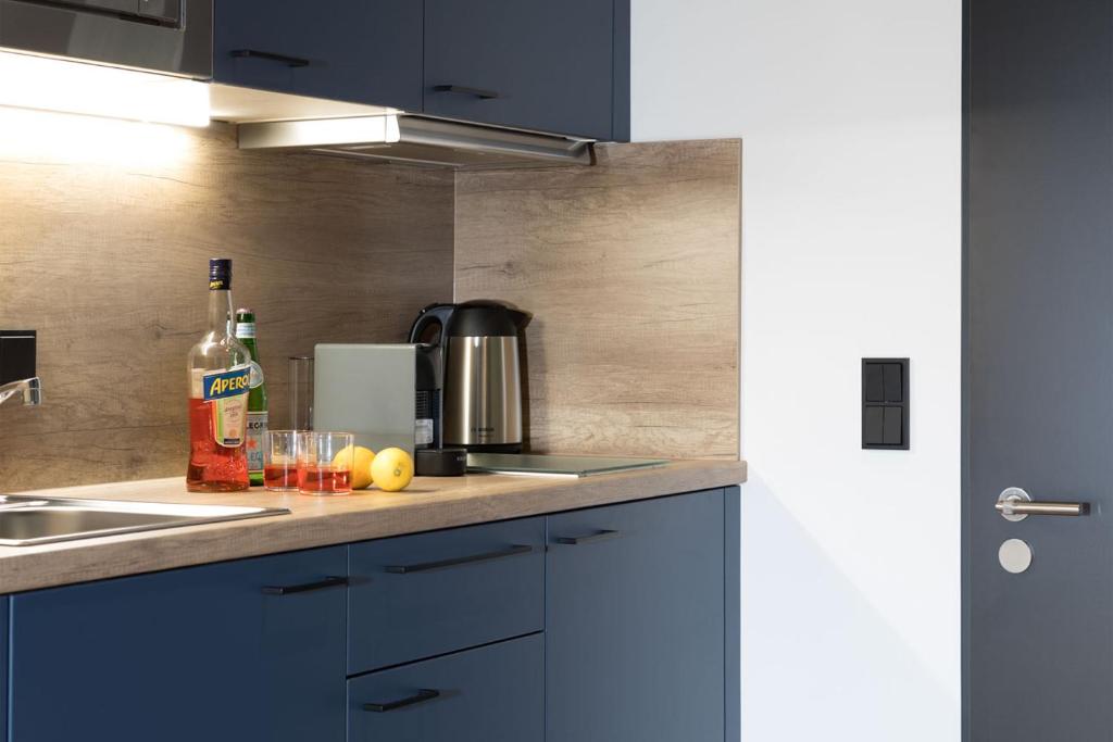 Kuchyň nebo kuchyňský kout v ubytování Brera Serviced Apartments Singen