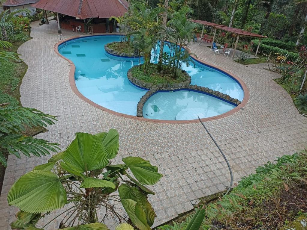 a swimming pool in a resort at HOSTERIA EL PARAISO in Pedro Vicente Maldonado