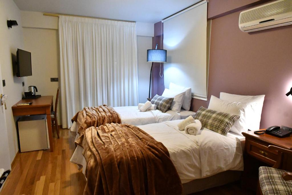 Postel nebo postele na pokoji v ubytování Porto Nafplio