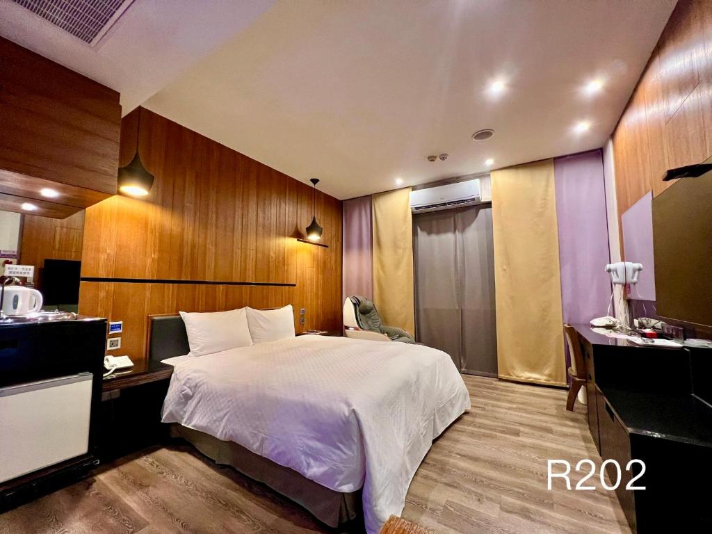 Postel nebo postele na pokoji v ubytování Catwalk Motel -Tainan