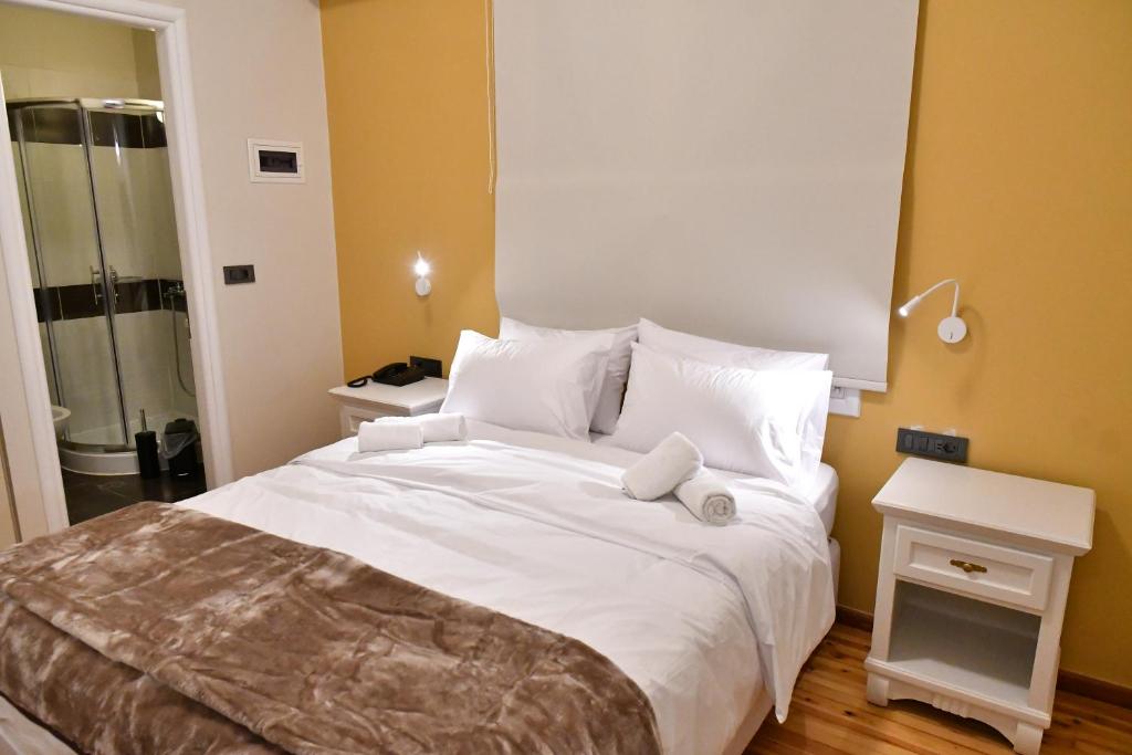 Postel nebo postele na pokoji v ubytování Porto Nafplio