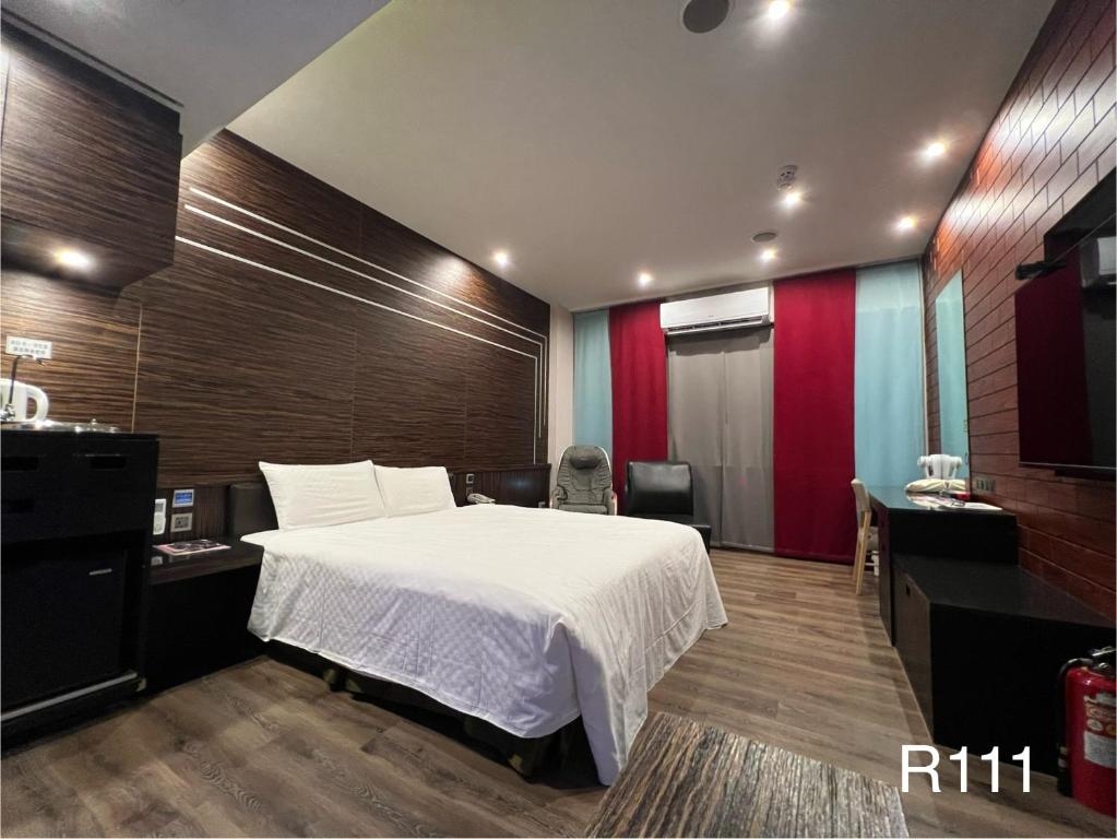 Postel nebo postele na pokoji v ubytování Catwalk Motel -Tainan