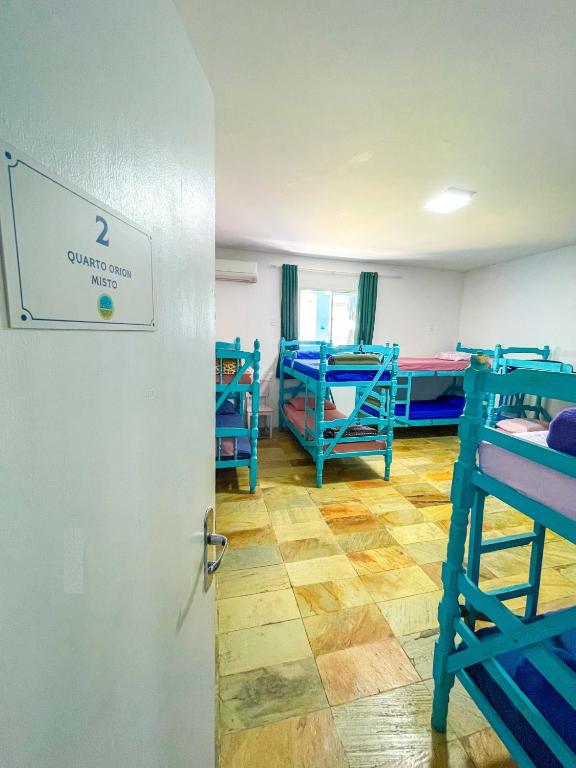 Postel nebo postele na pokoji v ubytování Onça da Praia Hostel