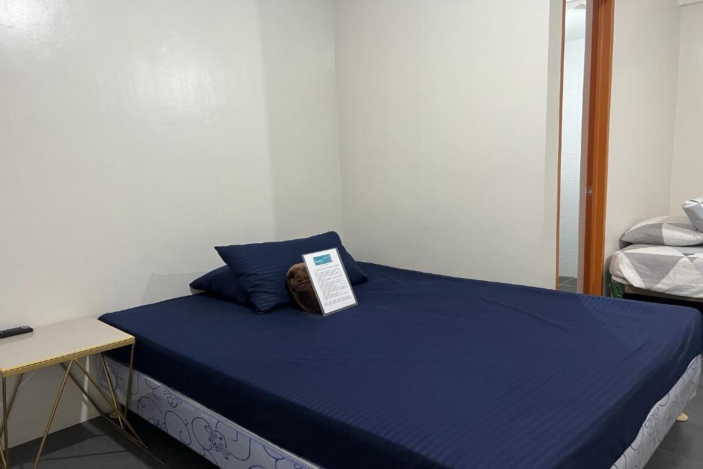 Postel nebo postele na pokoji v ubytování Happy Grey Hotel Vigan