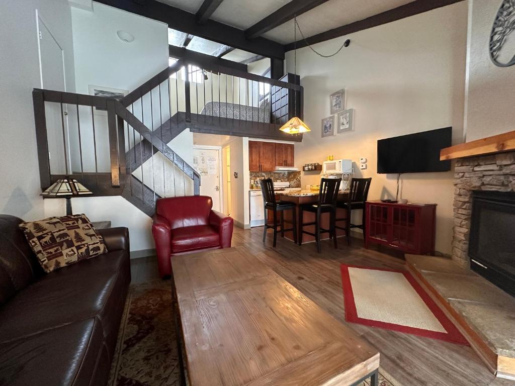 a living room with a couch and a dining room at Yosemite Condominium Loft unit -B202 in Yosemite West