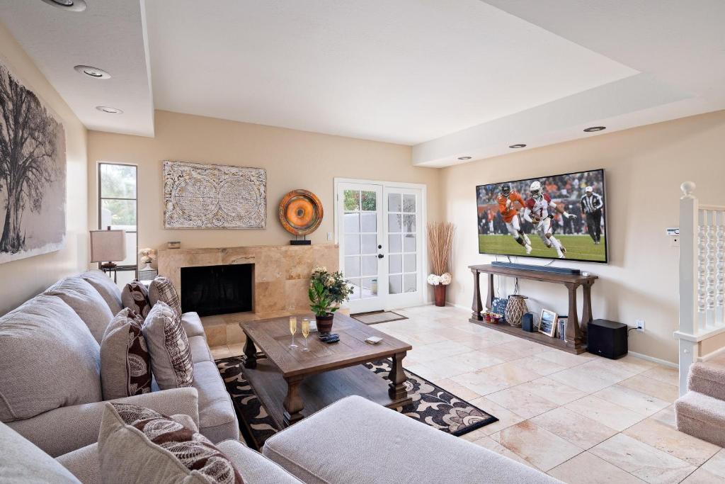 a living room with a couch and a fireplace at Scottsdale - 6206 N 30th Pl in Phoenix