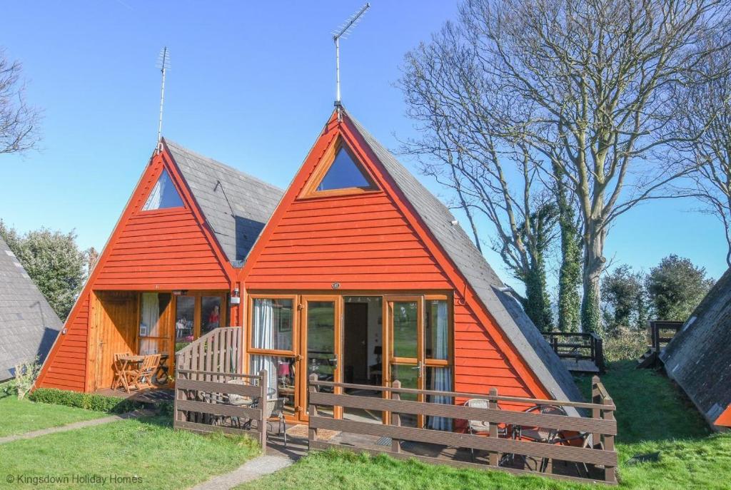 a small house with an orange roof at Chalet Seventeen in Deal