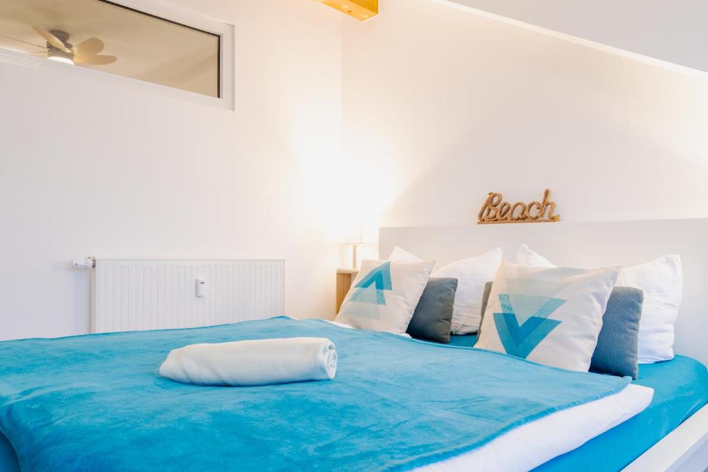 Postel nebo postele na pokoji v ubytování App 7o KleinerTag am Meer