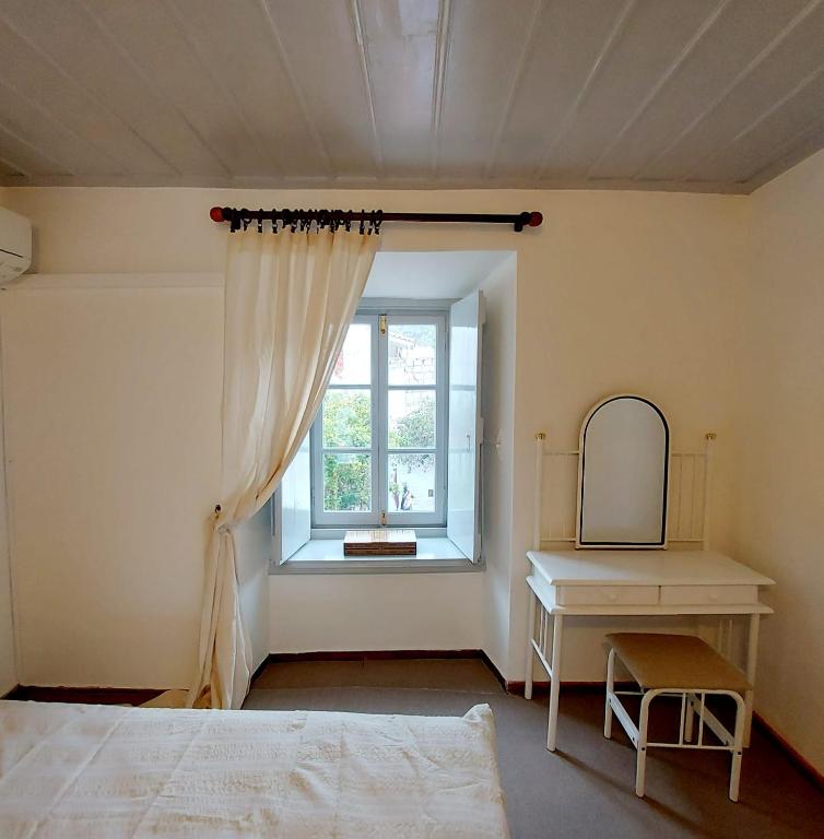 Postel nebo postele na pokoji v ubytování Danaë Port House