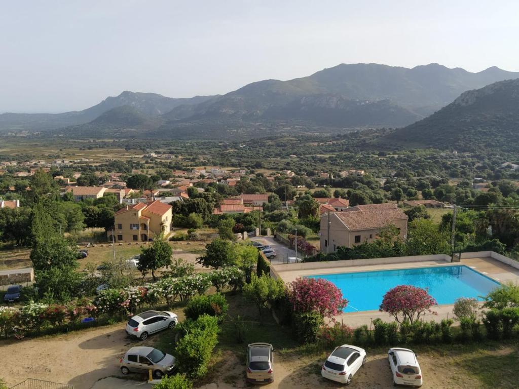arial view of a villa with a swimming pool at Appartement avec piscine partagée in Calenzana