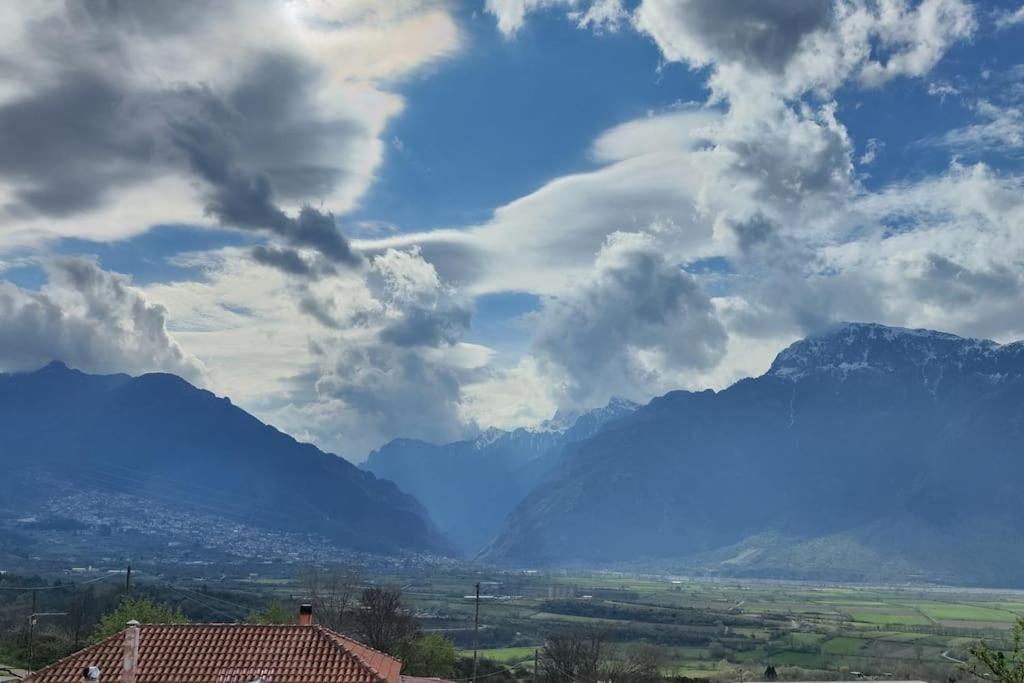a view of a mountain range with clouds in the sky at Agnes Cottage House in Konitsa