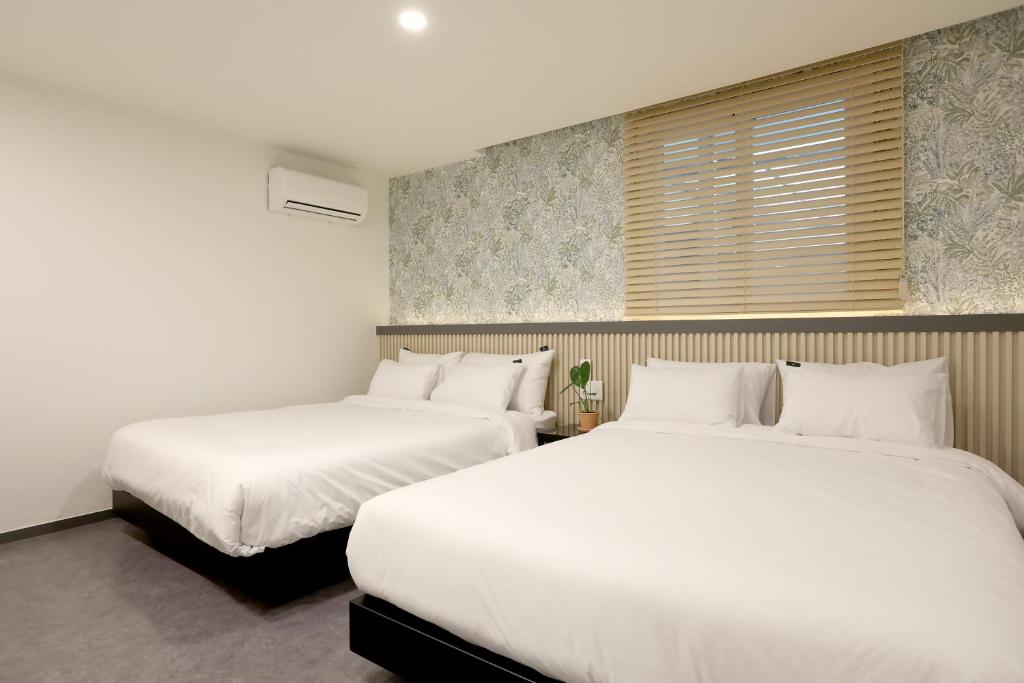 Postel nebo postele na pokoji v ubytování Luce Hotel