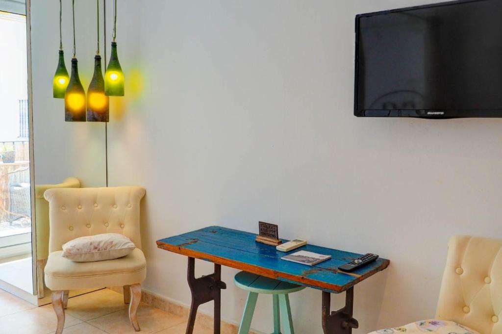 Televízia a/alebo spoločenská miestnosť v ubytovaní The Loft by Hello Homes Sitges