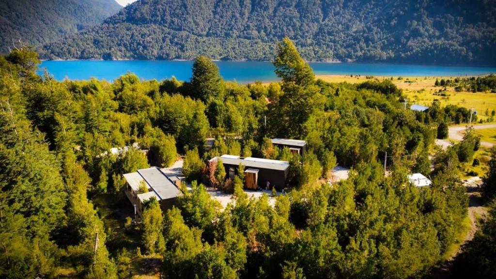 an aerial view of a house on a hill with a lake at Espectacular Loft en Lago Chapo M4 in Puerto Montt
