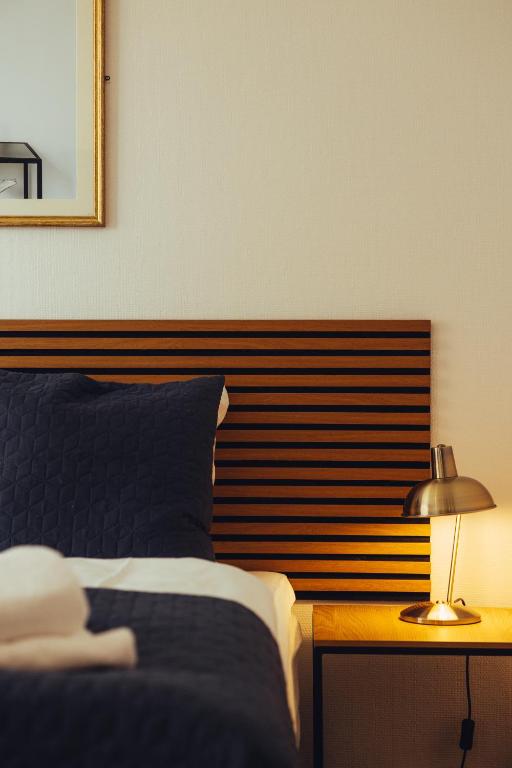 Postel nebo postele na pokoji v ubytování Milling Hotel Windsor