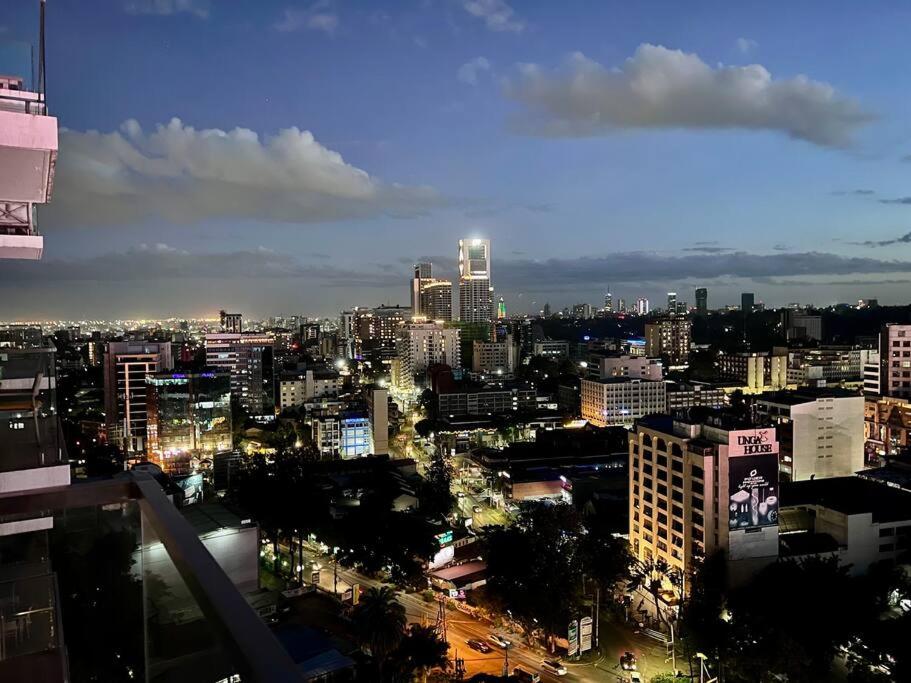 a view of a city at night with buildings at Skynest - 15th Floor in Nairobi