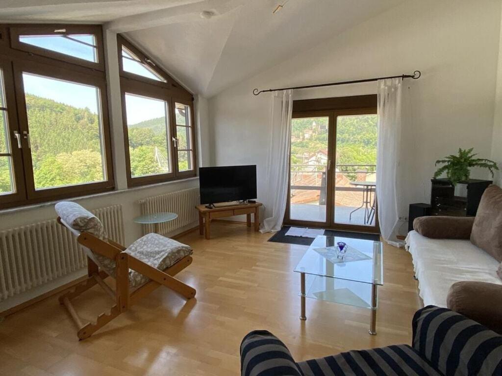 a living room with a couch and a table at Apartment in Zwingenberg in Zwingenberg