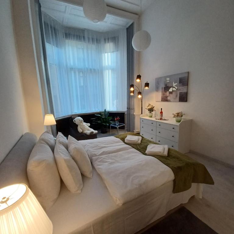 Posteľ alebo postele v izbe v ubytovaní Palace Apartment