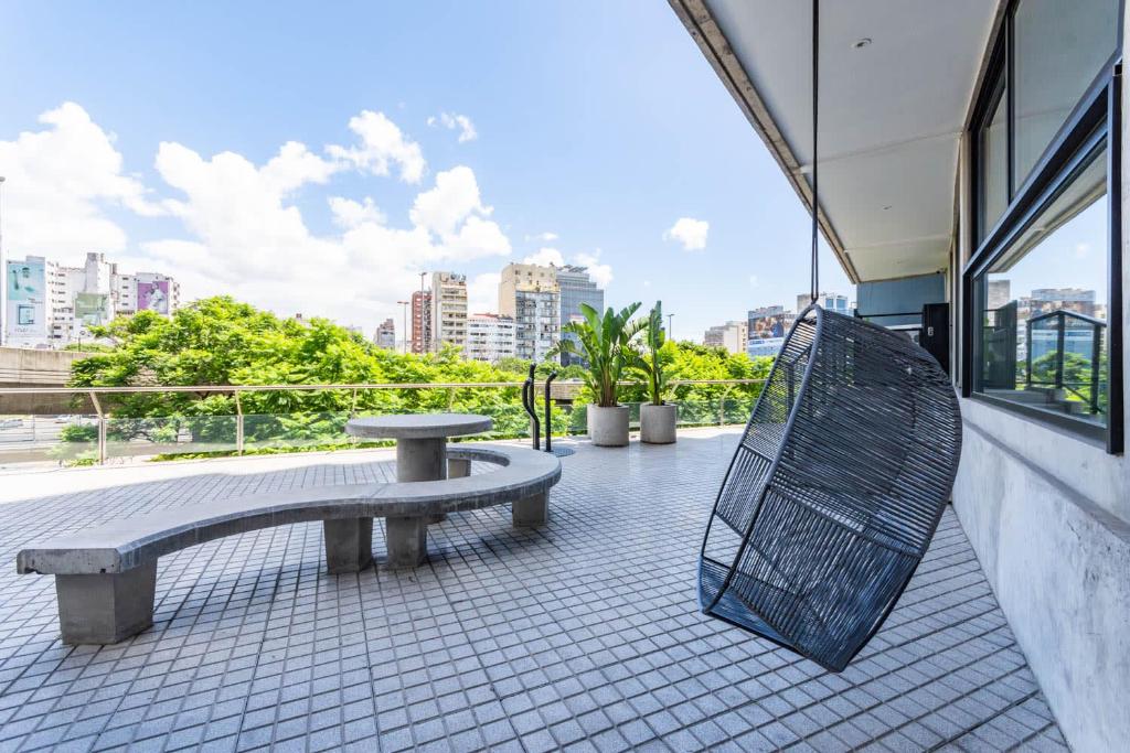 a bench sitting on the outside of a building at Loft Elegante a 5 Minutos de Puerto Madero 6B in Buenos Aires