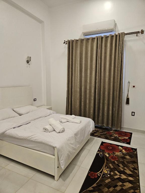 Postel nebo postele na pokoji v ubytování Panorama Hotel