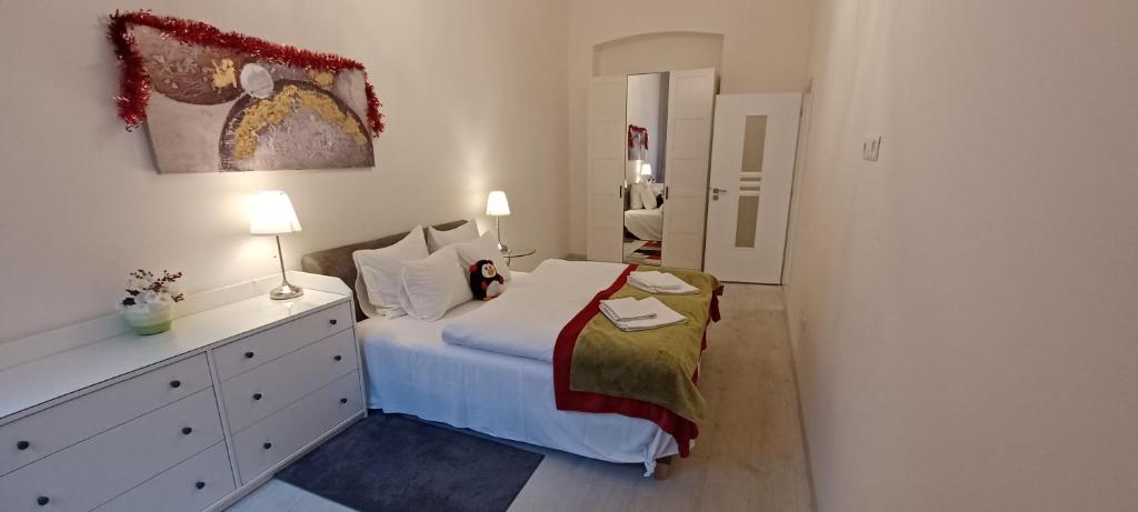 Posteľ alebo postele v izbe v ubytovaní Palace Apartment