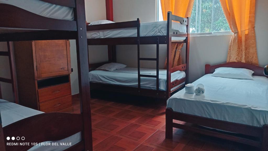 Postel nebo postele na pokoji v ubytování BackpackersHostel Flor del Valle