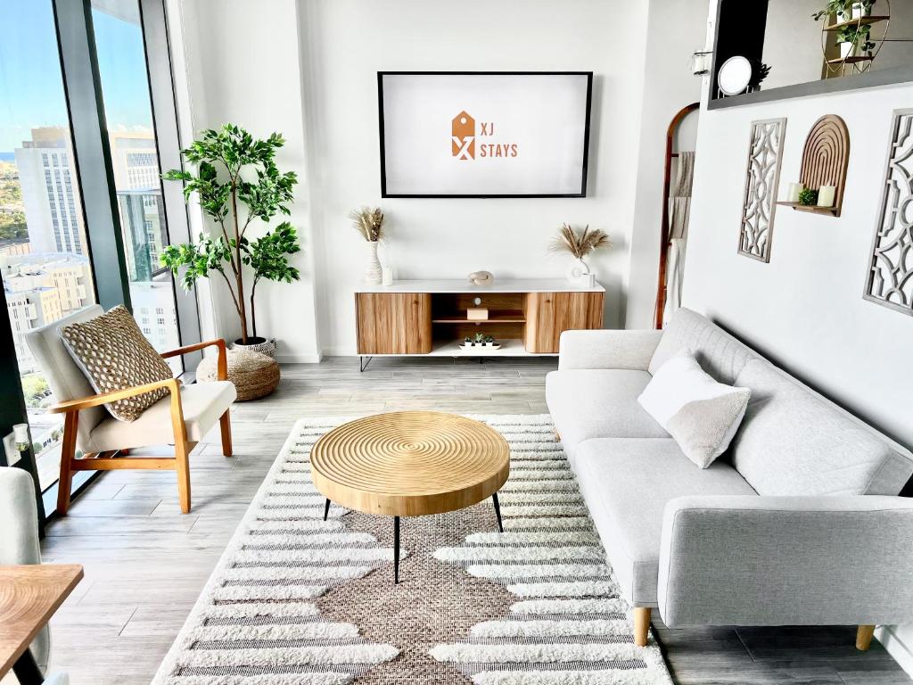 a living room with a couch and a coffee table at Sleek & Stylish Jr. 1-BR Retreat - Las Olas in Fort Lauderdale
