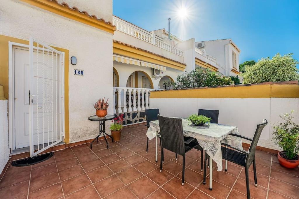a patio with a table and chairs on a balcony at Casa Del Sol in Gran Alacant