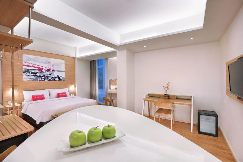 Postel nebo postele na pokoji v ubytování favehotel Palembang